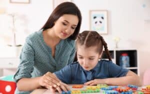 View of a parent and child working with puzzle pieces